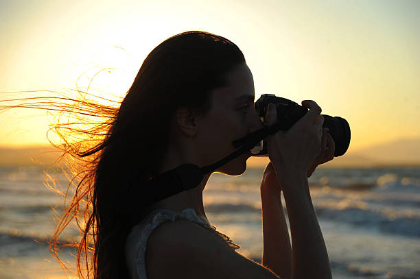 istock woman taking photographs 177439035