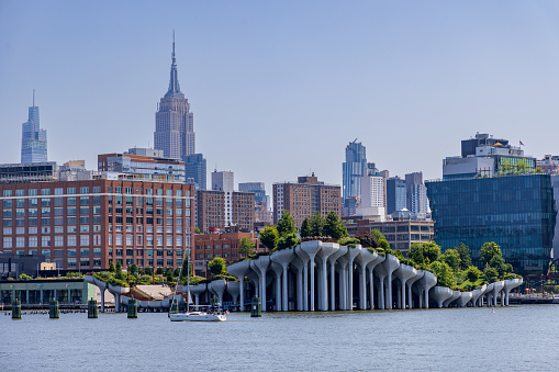 Close-up view of Little Island and Midtown Manhattan as seen from a boat on the Hudson river, New York City, USA