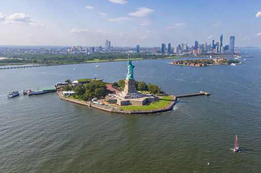 Aerial view of Liberty island and the Statue of Liberty with Jersey City in the background, New York City, USA