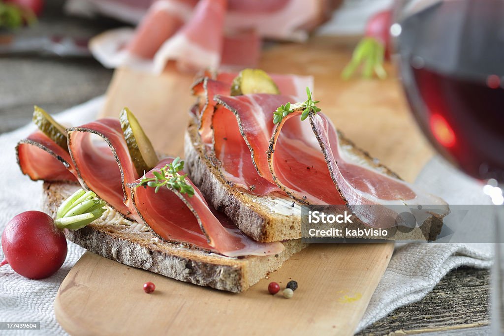 Close up of a smoked bacon dish South Tyrolean smoked bacon on farmhouse bread Bacon Stock Photo