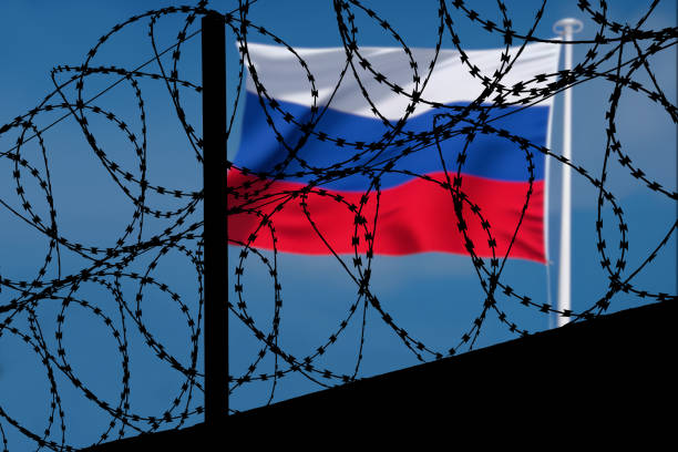 Russian flag behind barbed wire Russische Flagge hinter Stacheldraht Europa stock pictures, royalty-free photos & images