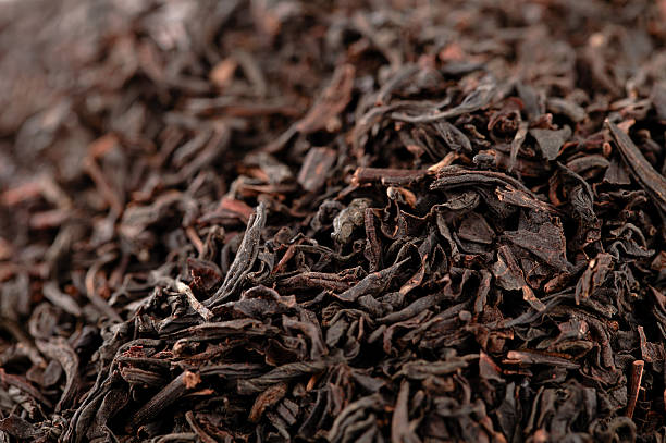 istock Earl Grey  black loose tea leaves background, shallow dof 177440526