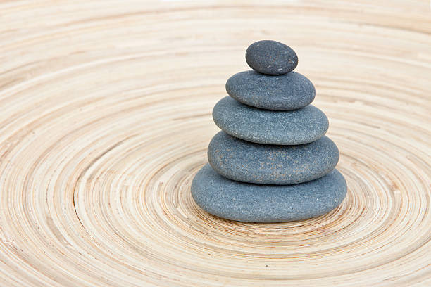 istock Balancing of pebbles on wooden background 177440607