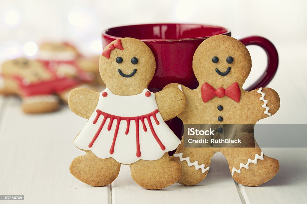 Gingerbread couple Gingerbread man and woman in red and white Gingerbread Man Stock Photo