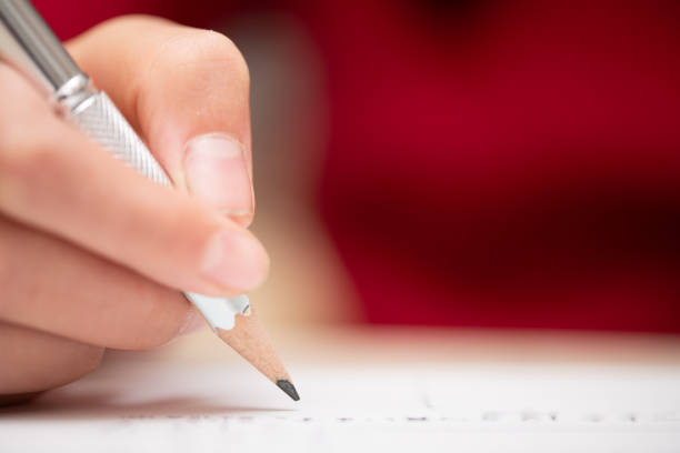 istock Hands of a child studying 1774407579