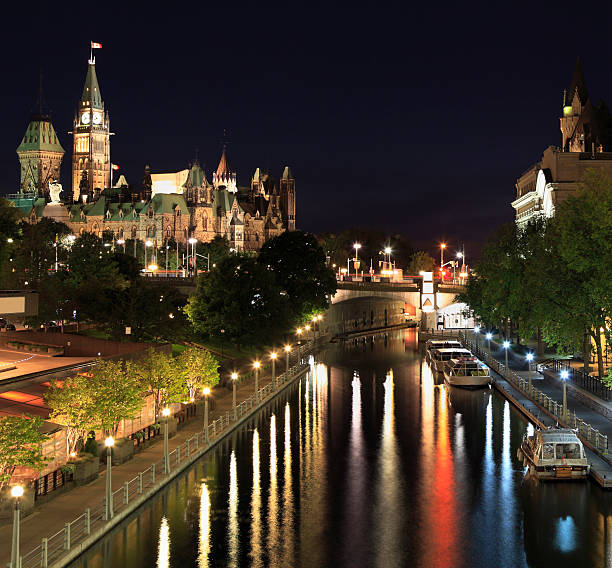 The Parliament of Canada and Rideau Canal at night, Ottawa "The Parliament of Canada and Rideau Canal at night, Ottawa" chateau laurier stock pictures, royalty-free photos & images