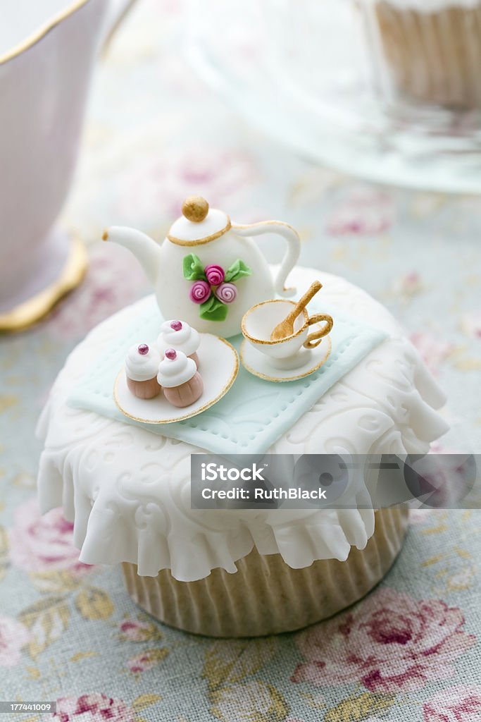 Tea party cupcake Cupcake decorated with a tiny fondant tea setMore from my portfolio - Afternoon Tea Stock Photo