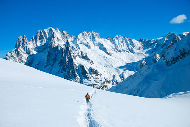Hikers in winter mountains stock photo