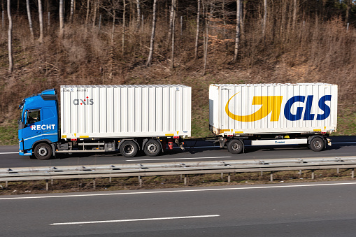 Wiehl, Germany - March 24, 2021: Recht Volvo FH combination truck with axis and GLS swop bodies on motorway