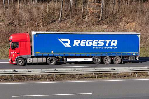 Wiehl, Germany - March 24, 2021: Regesta DAF XF truck with curtainside trailer on motorway