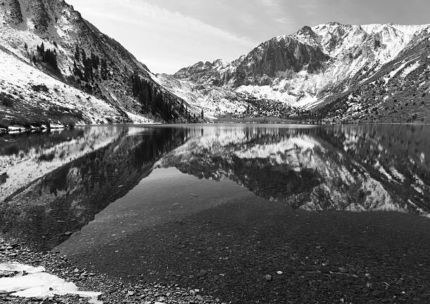 Winter reflections at alpine lake stock photo