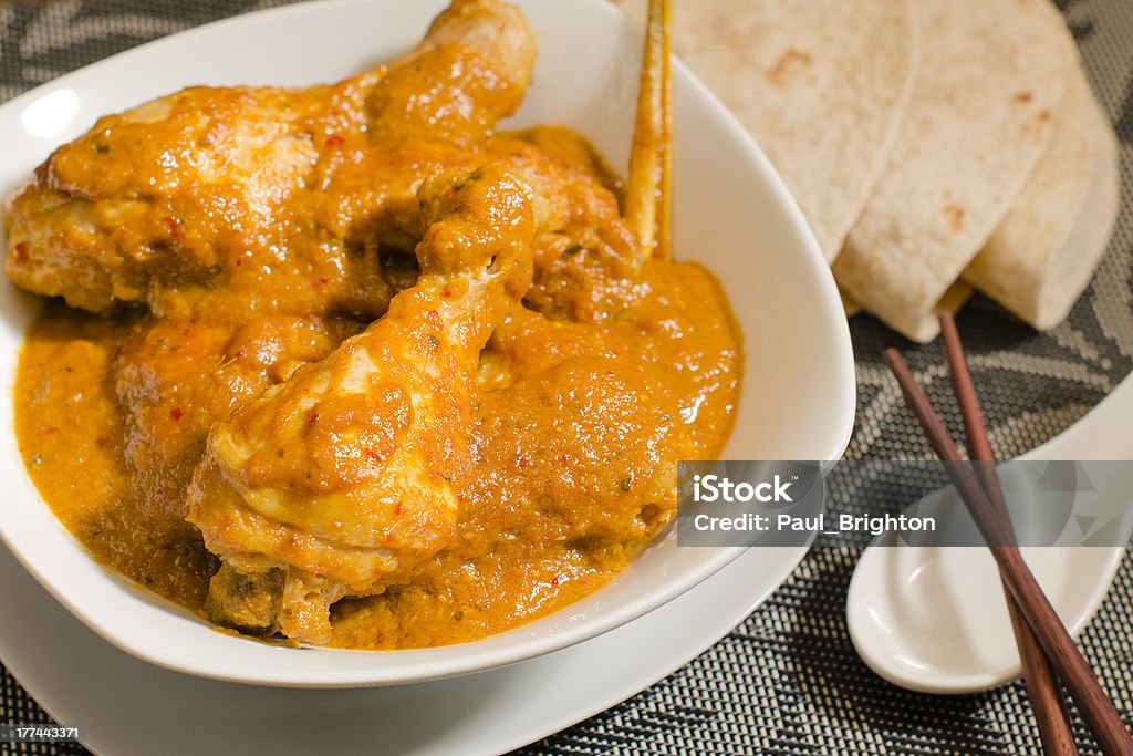 Kari Kapitan Ayam Kari Kapitan - Malaysian chicken curry with coconut milk served with roti. Traditional Nyonya cuisine. Boat Captain Stock Photo