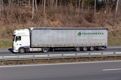 Wiehl, Germany - March 24, 2021: Transimeksa DAF XF truck with curtainside trailer on motorway