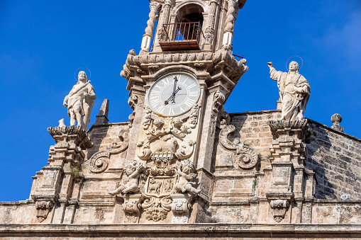 clock tower of the Sant Joan del Mercat church, a Roman Catholic church in the market district in the city of Valencia; Valencia, Spain