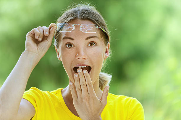 istock young woman in glasses is surprised 177443664