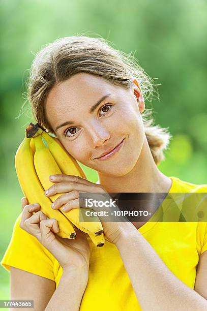 Young Woman In Yellow Blouse With Banana Stock Photo - Download Image Now - Food, Adult, Adults Only