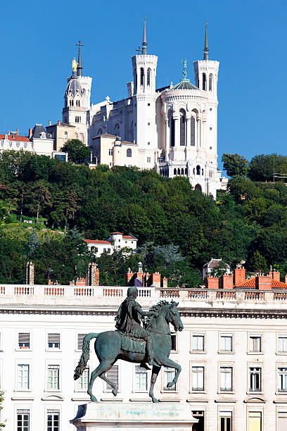 istock statue of Louis XIV and Basilique Fourviere 177443929