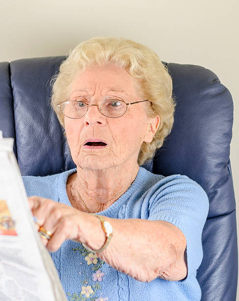 istock Old Woman Reading Newspaper 177444654