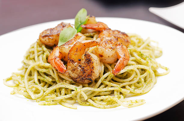 istock plate of spaghetti broccoli pesto and prawn ready for serving 177444739