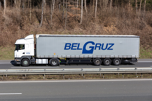 Wiehl, Germany - March 24, 2021: Belgruz Scania truck with curtainside trailer on motorway