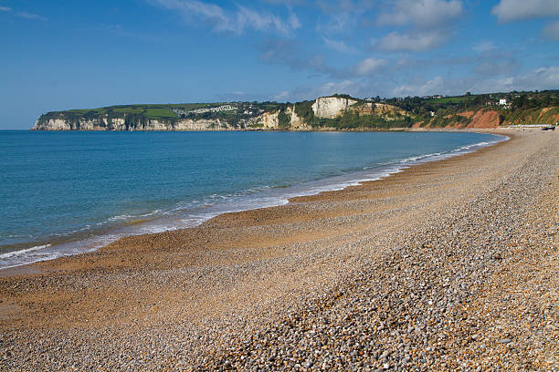 istock Shingle beach in Devon England at Seaton with blue sky 177445254