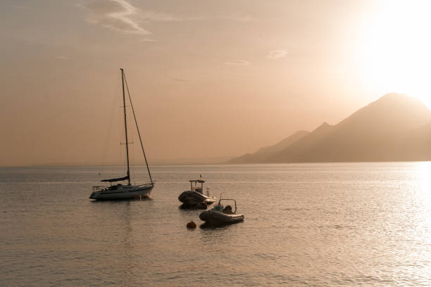 Boats during sunset on Lake Garda