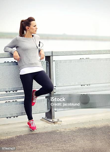 Female Jogger Resting Stock Photo - Download Image Now - 20-24 Years, Active Lifestyle, Adult