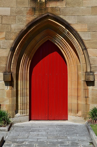 A red door on a church in The Rocks area of Sydney, Australia