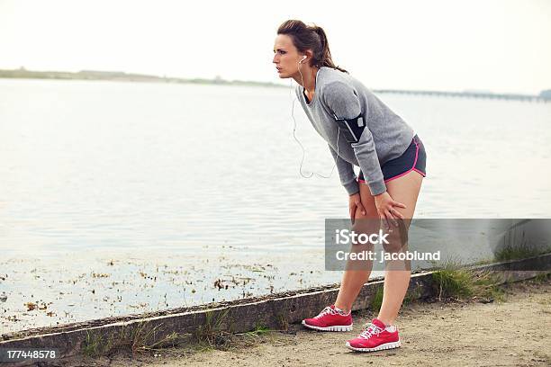 Woman Resting After Running Stock Photo - Download Image Now - Athlete, Marathon, Side View