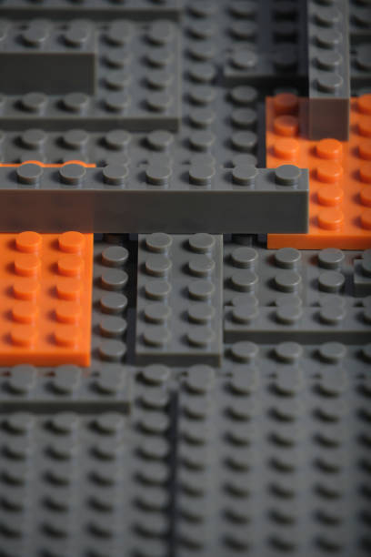 istock Abstract gray orange background from plastic building block children designer. 1774486646