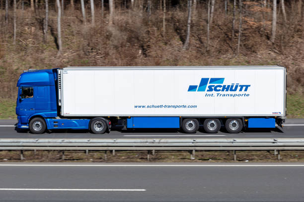 Schütt DAF XF truck with temperature controlled trailer on motorway Wiehl, Germany - March 24, 2021: Schütt DAF XF truck with temperature controlled trailer on motorway schutt stock pictures, royalty-free photos & images