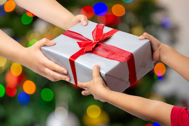 istock Mother giving christmas present to her child 1774500320