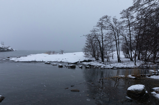 Foggy weather and snowfall in Uunisaari, an island in front of Helsinki, Finland