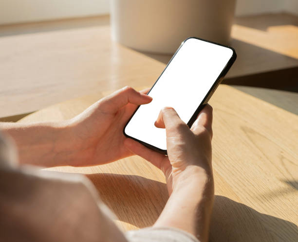 Hands holding mobile phone screen mockup, texting, typing with fingers