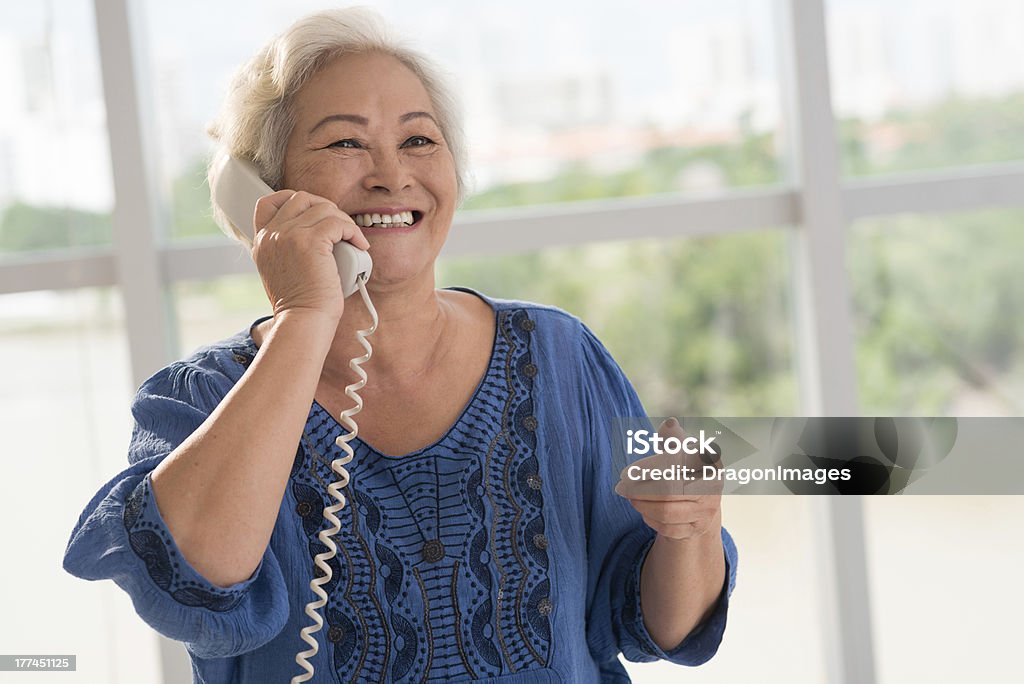 Woman on the phone Positive senior woman talking on the phone Senior Adult Stock Photo