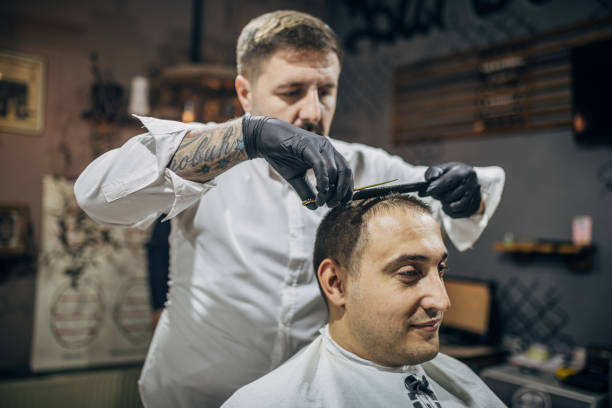 istock Cutting hair at barbershop 1774515901