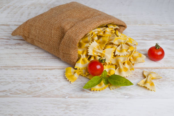 Dry pasta closeup uncooked on background