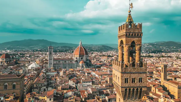 Photo of Palazzo Vecchio Clock Tower in Florence, aerial view of Palazzo Vecchio in Florence, Historically and Culturally Rich Italian Town Florence, Firenze - Aerial view of the city of Florence, Popular tourist destination in the world