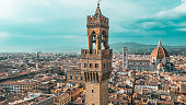 Palazzo Vecchio Clock Tower in Florence, aerial view of Palazzo Vecchio in Florence, Historically and Culturally Rich Italian Town Florence, Firenze - Aerial view of the city of Florence, Popular tourist destination in the world
