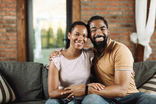 istock Happy black couple embracing at home. 1774542017
