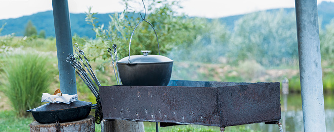 Cooking in nature. Kettle on fire in the background of the mountains