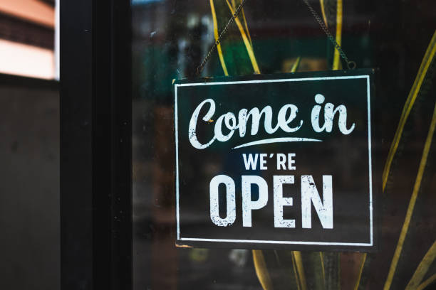 istock Text on vintage black sign Come in we're open in cafe. 1774544724