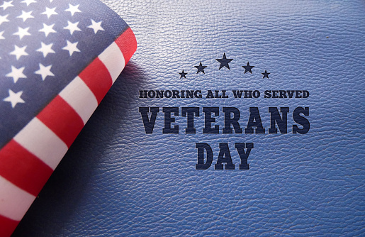 Happy Veterans Day concept - Honoring All Who Served Text with American Flag. November 11.