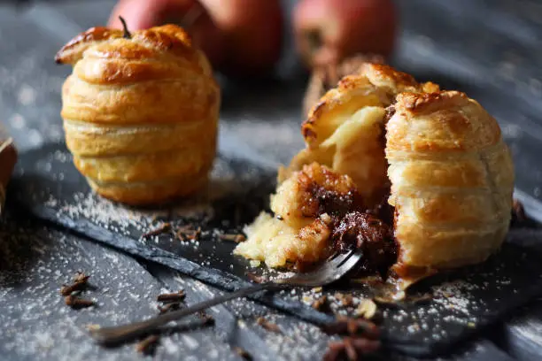 Baked apples in puff pastry (with chocolate). Selective focus