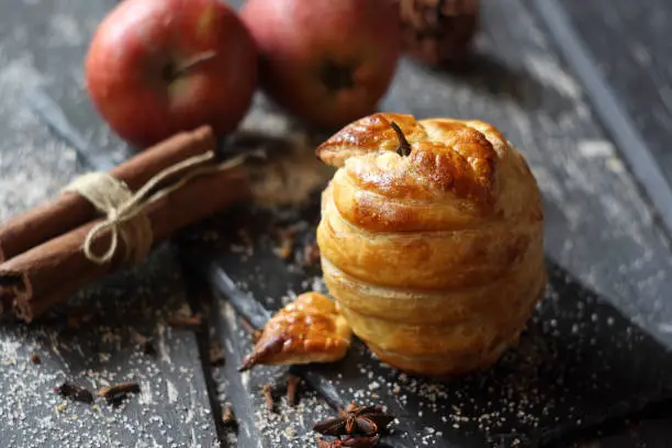 Baked apples in puff pastry (with chocolate). Selective focus