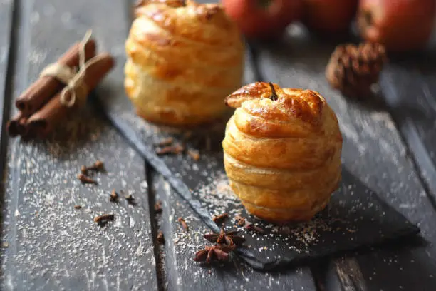 Baked apples in puff pastry (with chocolate). Selective focus