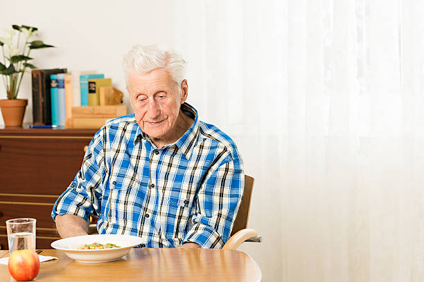 istock Portrait of senior man sitting at table 177454688