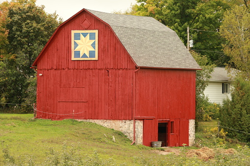 A large ol barn in fresh red paint.