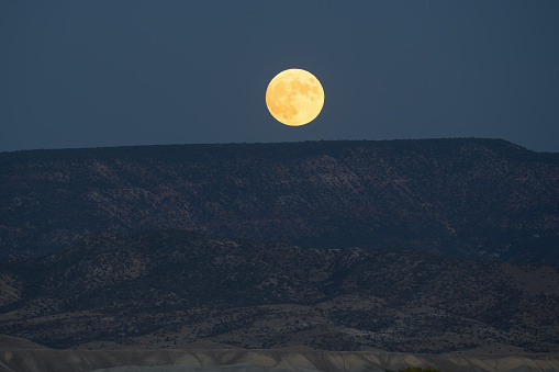 Landscape of moonrise over mesa, Montrose, Colorado, USA