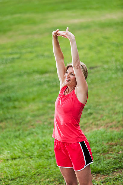 istock Woman exercising in park 177455516